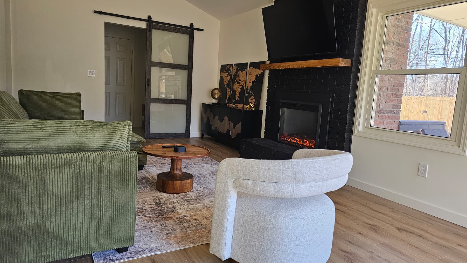 Modern living room with large windows and mountain views